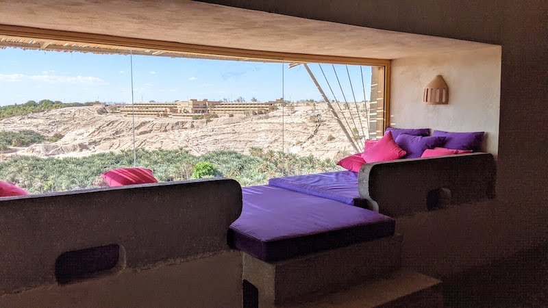Large window in room overlooking the oasis below