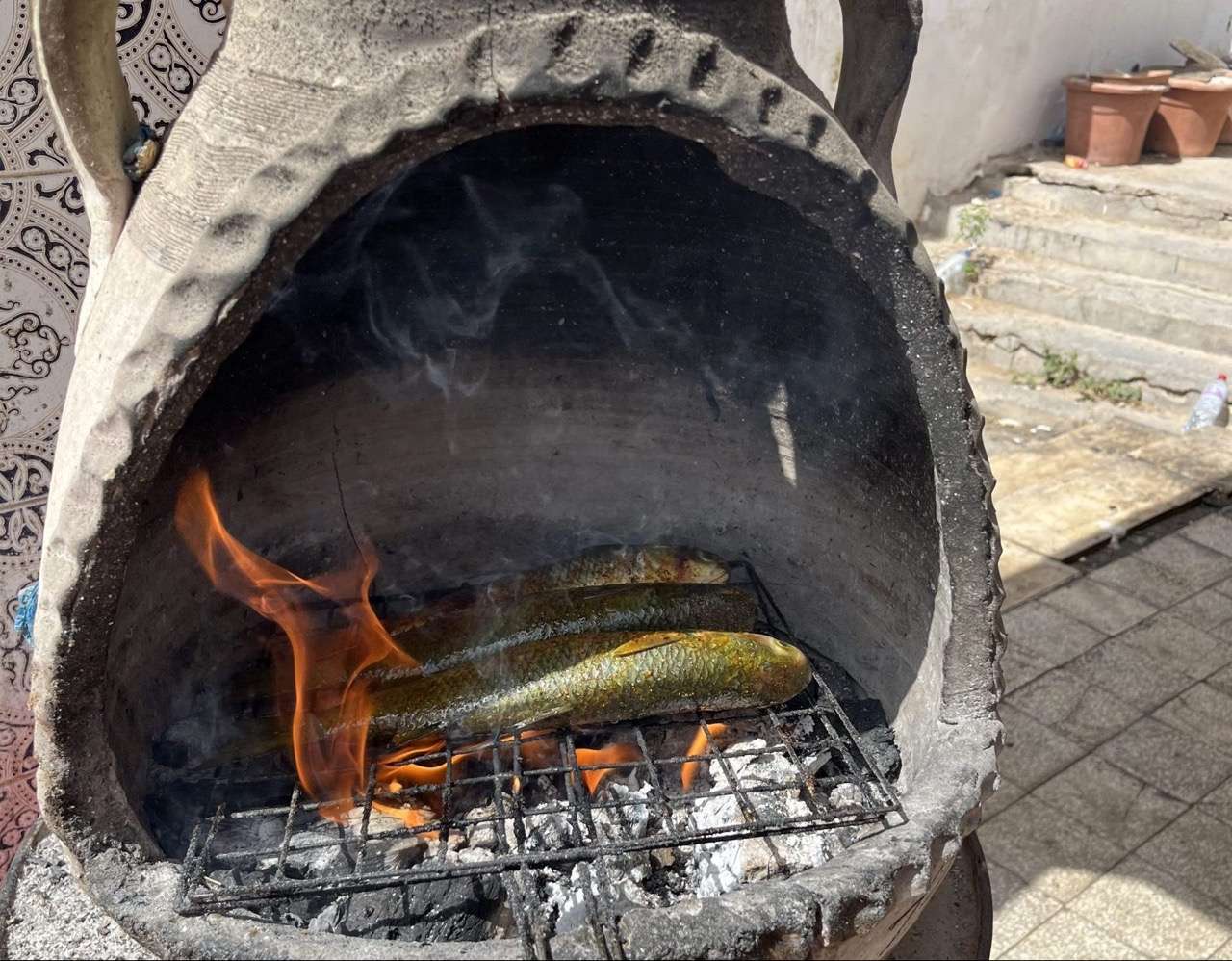 Fish over charcoal fire