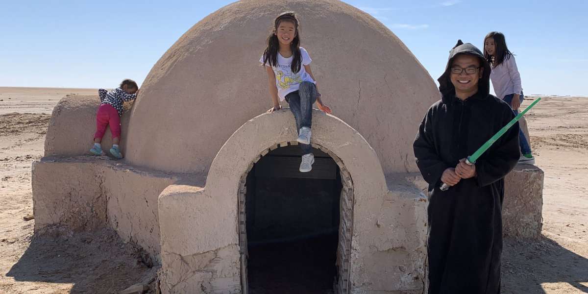 Ivan & kids in front of Lars Homestead Exterior
